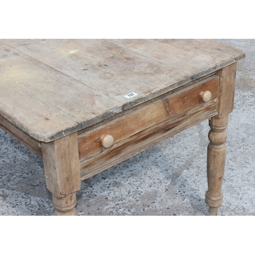 107 - A Victorian country pine farmhouse kitchen table with single drawer, approx 113cm x 83cm