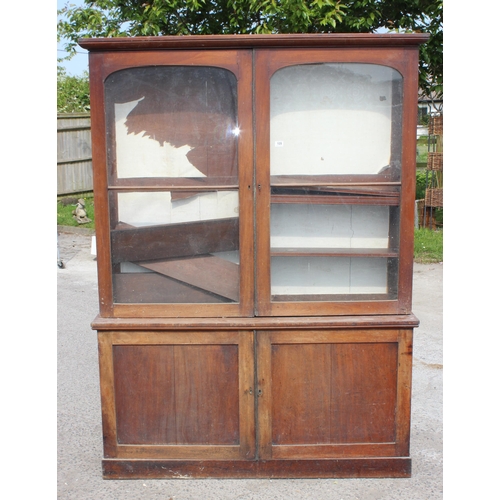 109 - A large 19th century mahogany glazed bookcase with cupboard base, approx 220cm tall x 158cm wide