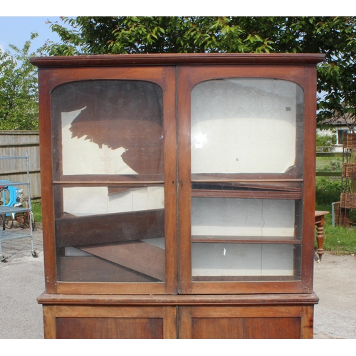 109 - A large 19th century mahogany glazed bookcase with cupboard base, approx 220cm tall x 158cm wide