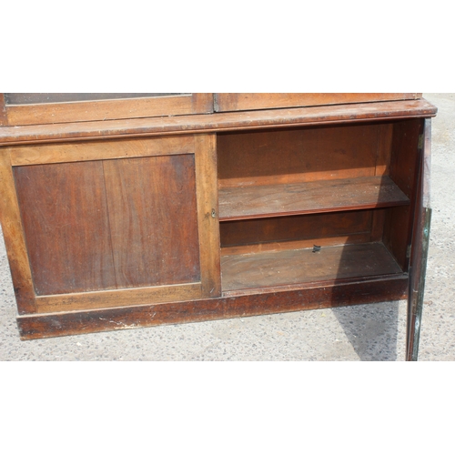 109 - A large 19th century mahogany glazed bookcase with cupboard base, approx 220cm tall x 158cm wide