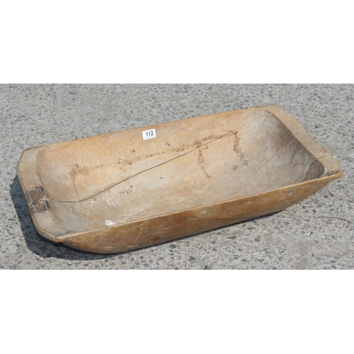 112 - A European wooden trencher style dough bowl or trough with vintage metal repair, approx 82cm x 40cm