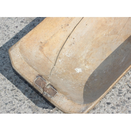 112 - A European wooden trencher style dough bowl or trough with vintage metal repair, approx 82cm x 40cm