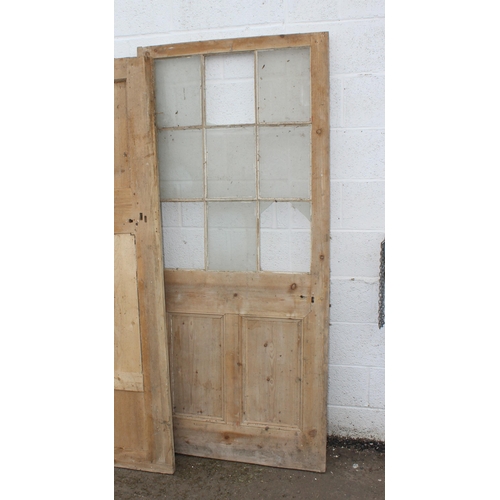 118 - 3 antique stripped pine doors, the largest approx 198cm x 88cm