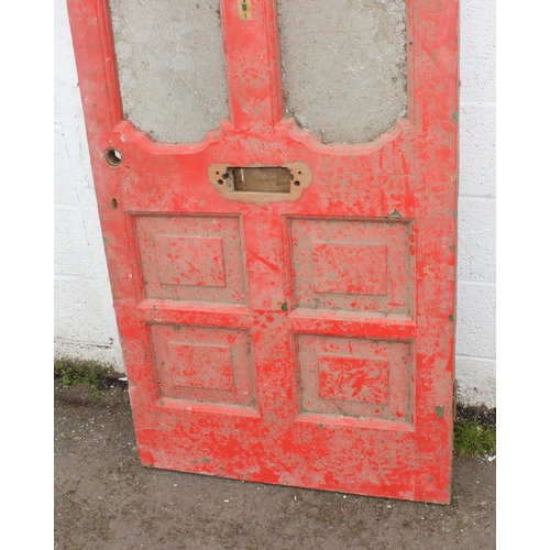 119 - An antique red painted front door in the gothic revival style, approx 203cm x 81cm