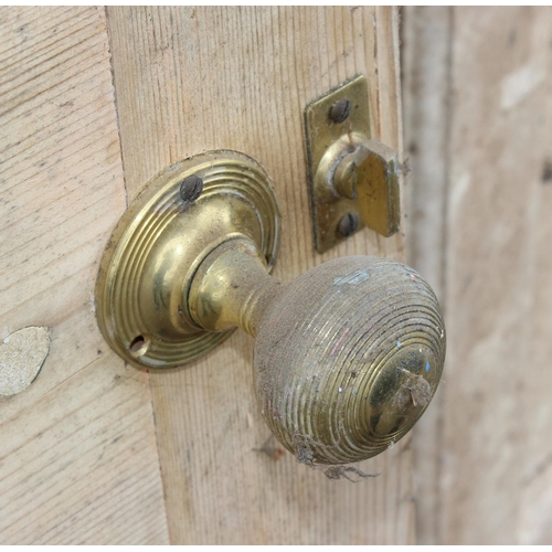 120 - 3 antique stripped pine doors, 2 with brass door furniture, the largest approx 203cm x 82cm