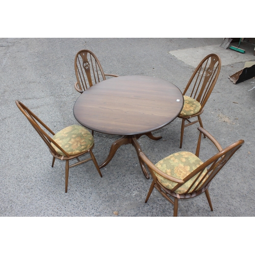 122 - Ercol circular table and 4 Ercol Windsor Swan 876 dining chairs, 2 carvers and 2 dining, the table a... 