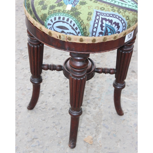 126 - A 19th century screw topped piano stool with stuffed and upholstered seat