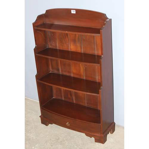 136 - A modern mahogany waterfall bookcase with single drawer, approx 66cm wide x 107cm tall