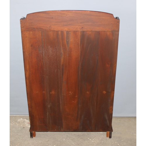 136 - A modern mahogany waterfall bookcase with single drawer, approx 66cm wide x 107cm tall