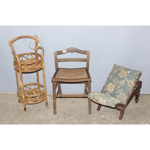 138 - A vintage upholstered gout stool, a vintage small Bergere seated stool and a retro bamboo effect 2 t... 