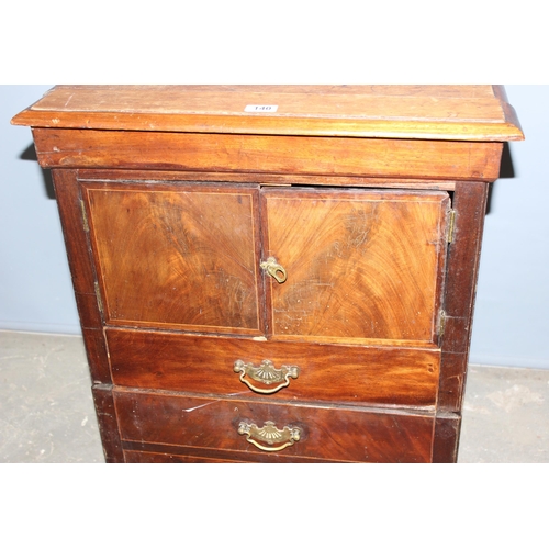 140 - A 17th century style carved wooden chair and a small antique mahogany cupboard with drawers, approx ... 