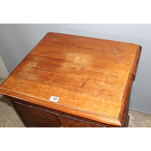 140 - A 17th century style carved wooden chair and a small antique mahogany cupboard with drawers, approx ... 