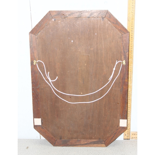 407 - An early 20th century oak framed elongated octagonal mirror, approx 65cm x 43cm