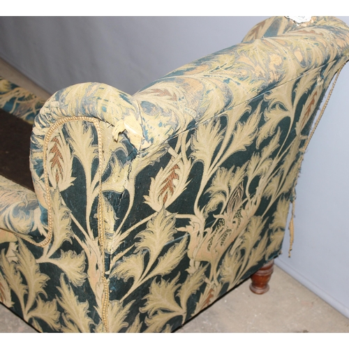 40A - In the manner of Howard & Sons of London, a late Victorian day bed chair of unusual long form, with ... 