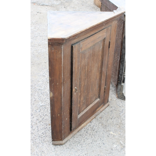 93 - 2 antique pine corner units, both with stained finish, one with glazed doors, largest approx 87cm wi... 