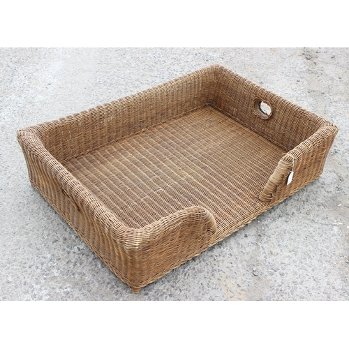 95 - Large wicker dog bed, approx 105cm wide