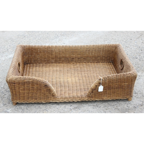 95 - Large wicker dog bed, approx 105cm wide