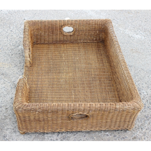 95 - Large wicker dog bed, approx 105cm wide