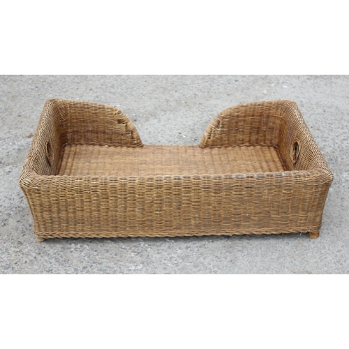 95 - Large wicker dog bed, approx 105cm wide