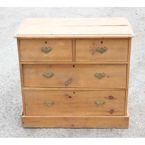 98 - A Victorian stripped pine 2 over 2 chest of drawers with brass drop handles, approx 83cm wide