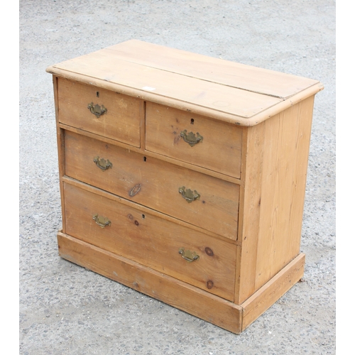 98 - A Victorian stripped pine 2 over 2 chest of drawers with brass drop handles, approx 83cm wide