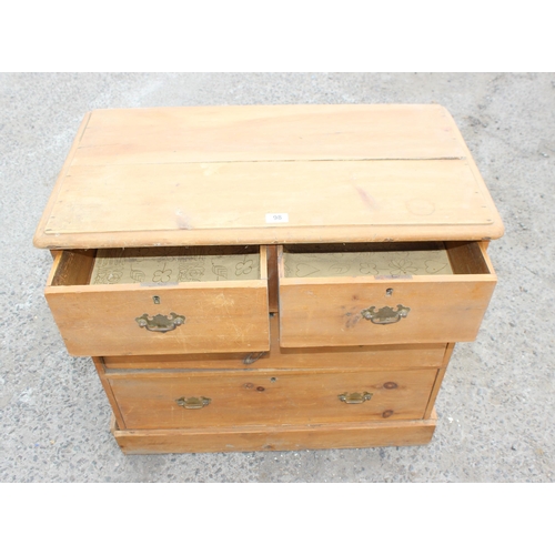 98 - A Victorian stripped pine 2 over 2 chest of drawers with brass drop handles, approx 83cm wide