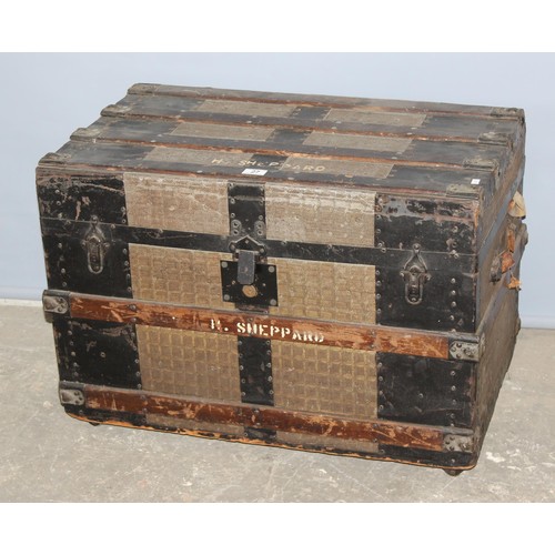 27 - A large vintage metal banded shipping trunk with flat top, approx 77cm wide x 47cm deep x 56cm tall