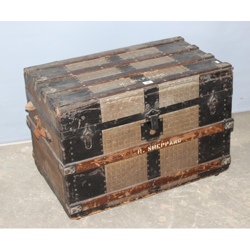 27 - A large vintage metal banded shipping trunk with flat top, approx 77cm wide x 47cm deep x 56cm tall