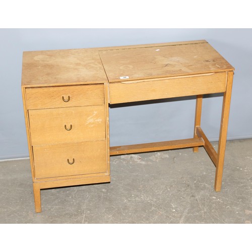 37 - A retro Stag 3 drawer desk with lift up lidded compartment, approx 97cm wide