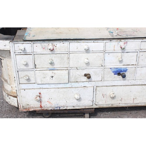 71 - A Victorian painted pine haberdashery shop counter consisting of 27 different sized drawers to one s... 