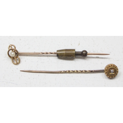 1146A - 2 antique 15ct gold stick pins, one set with seed pearl the other a small diamond, the heads both 15... 