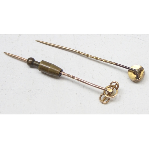 1146A - 2 antique 15ct gold stick pins, one set with seed pearl the other a small diamond, the heads both 15... 