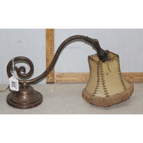 238A - An unusual early 20th century adjustable lamp with hide shade, possibly a downlighter for the top of... 