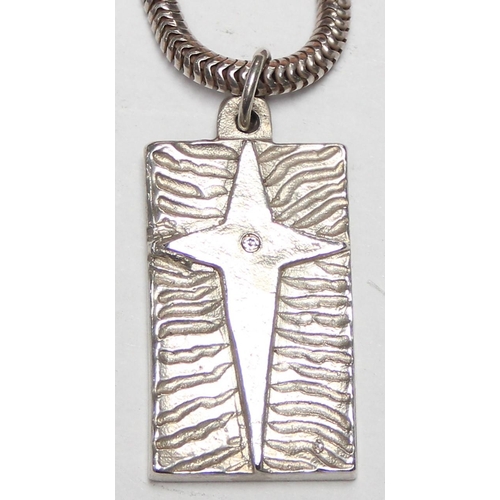 1117 - A retro silver star designed pendant ingot on silver snake chain, approx 40cm long chain, approx 28.... 