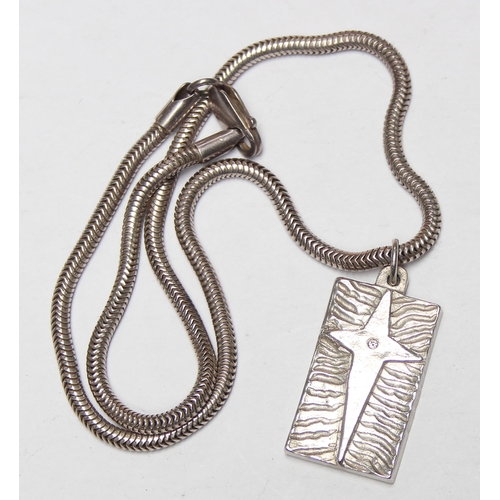 1117 - A retro silver star designed pendant ingot on silver snake chain, approx 40cm long chain, approx 28.... 