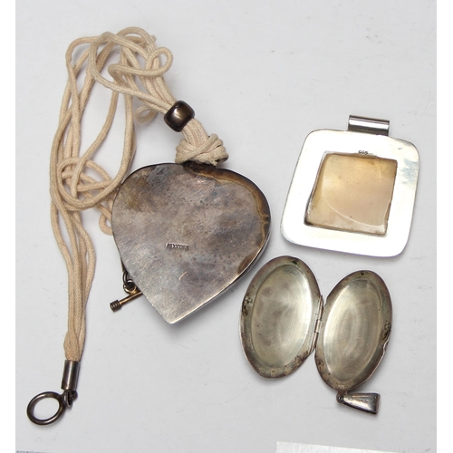 1123 - A silver locket, silver mounted pendant and a silver heart shaped pendant, all XRF tested to confirm... 