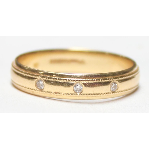 1129 - An 18ct gold wedding band ring set with 3 small diamonds, marked for Birmingham 1998, approx size P,... 