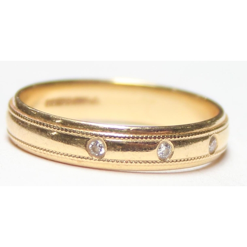 1129 - An 18ct gold wedding band ring set with 3 small diamonds, marked for Birmingham 1998, approx size P,... 