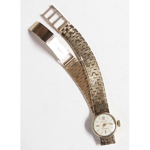 1306 - A 9ct gold ladies watch by Accurist, with 9ct gold case and strap, approx 26.13g gross