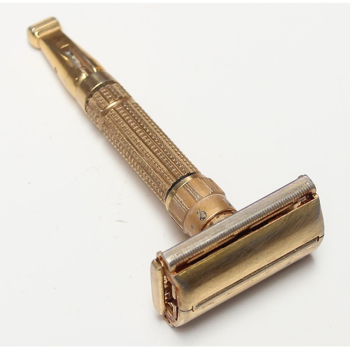 1608 - An unusual vintage Gillette gold plated razor, believed to be a D-1 Toggle