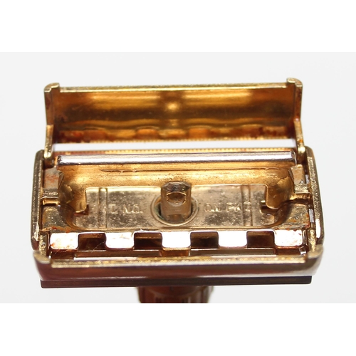 1608 - An unusual vintage Gillette gold plated razor, believed to be a D-1 Toggle