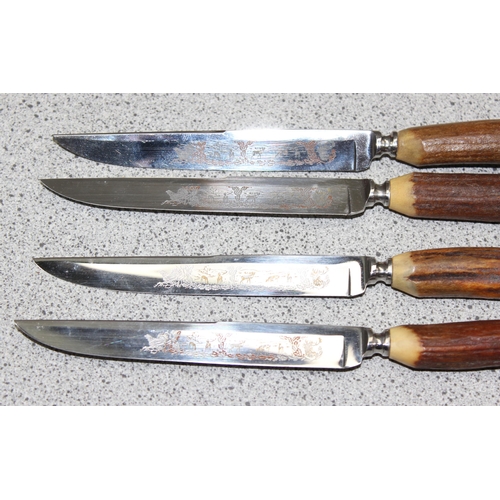 1026 - Part set of four Hoffritz etched hunting scene steel bladed steak knives with antler bone handles in... 