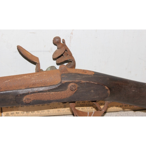 1425 - A large antique flintlock rifle or musket, no visible marking, approx 147cm long