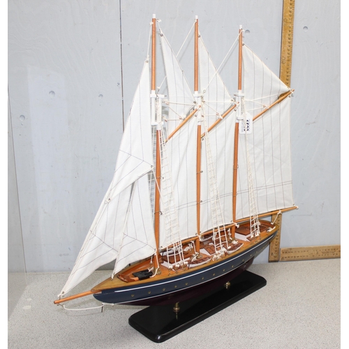 1523 - Large multi-sailed painted wooden hulled model yacht on ebonised stand - approx 60cm long by 70cm ta... 