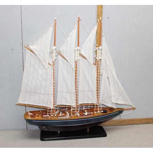 1523 - Large multi-sailed painted wooden hulled model yacht on ebonised stand - approx 60cm long by 70cm ta... 