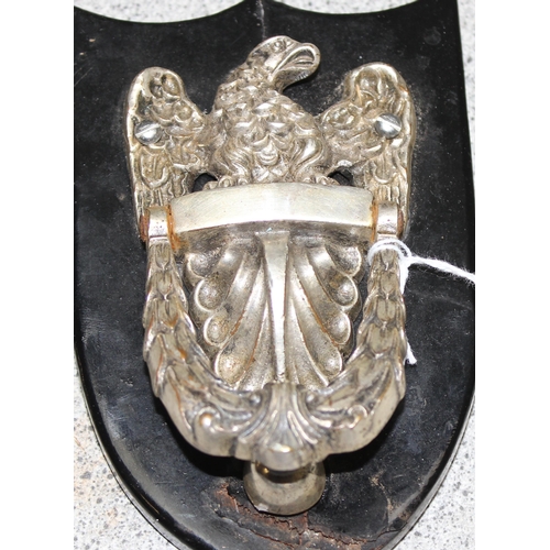 1620 - Silver plated vintage American eagle door knocker on black wooden
shield shaped back plate