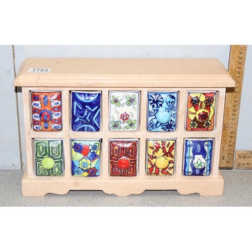 1762 - Set of 10 colourful hand painted ceramic drawers in a wooden cased surround