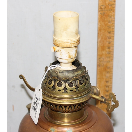 254 - '‘Veritas lamp works’ late 19c large copper reservoir oil lamp on Arts and Crafts wrought iron detac... 