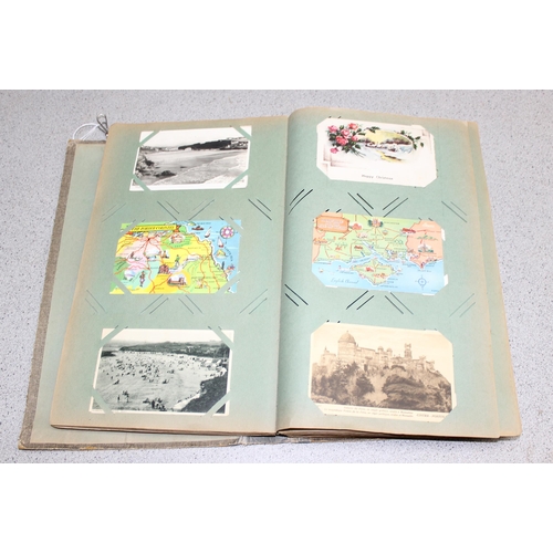 505 - Vintage postcard album and contents