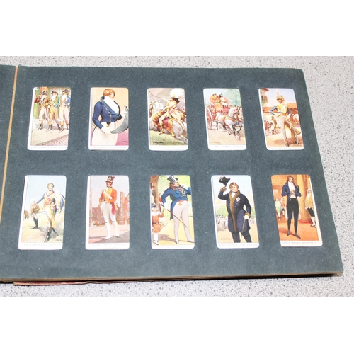 511 - Early 20c Wills cigarette card album containing four near but incomplete sets of Dandies, butterflie... 